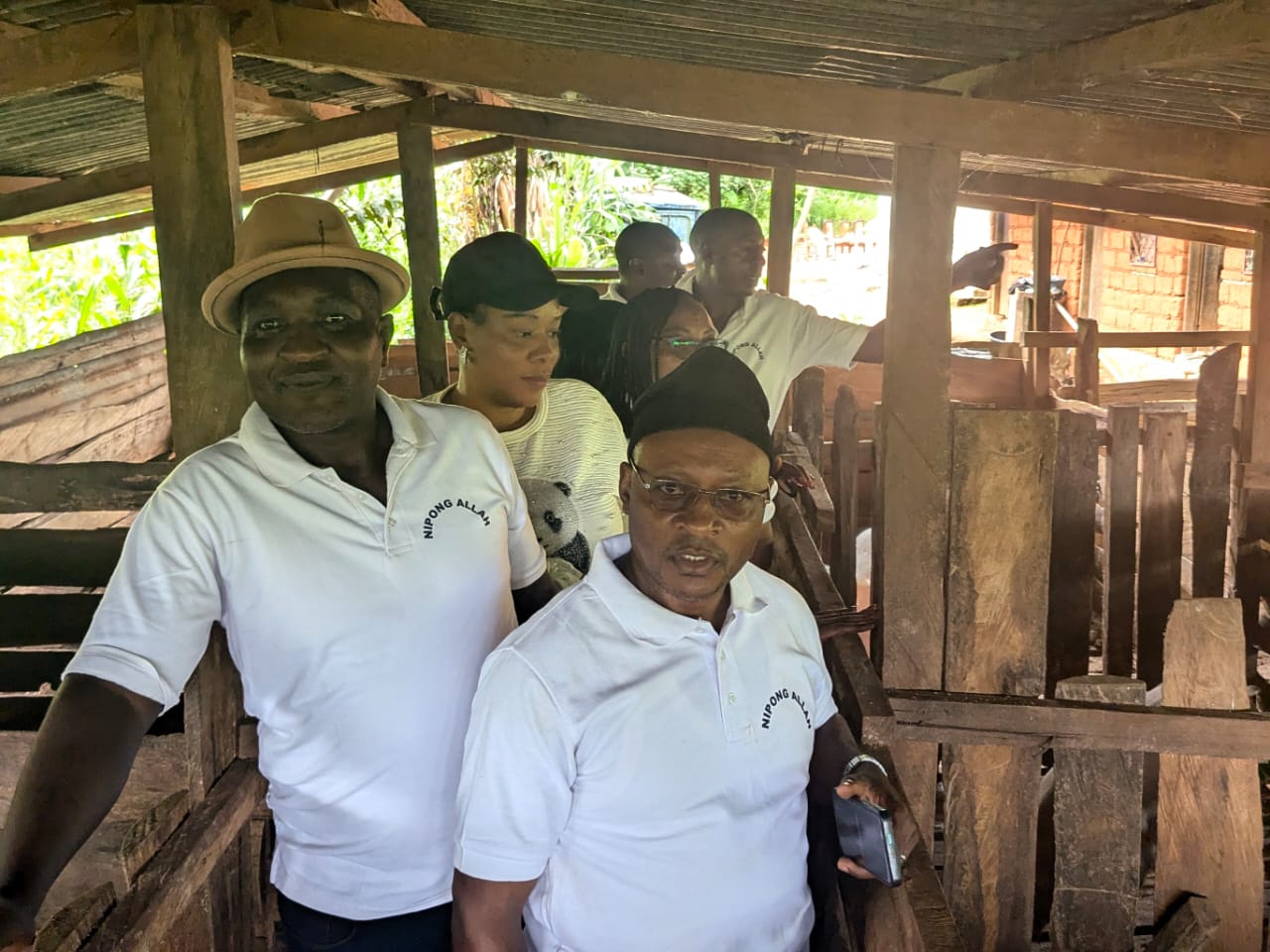 Members inspecting the pig farm